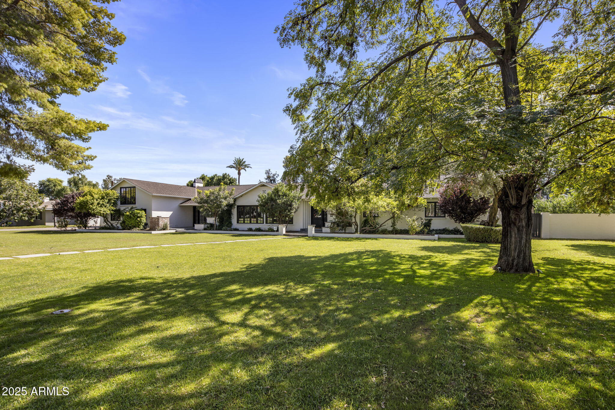 525 West Berridge Lane Phoenix, AZ 85013 - Photo 63 of 67 a view of yard with swimming pool and trees