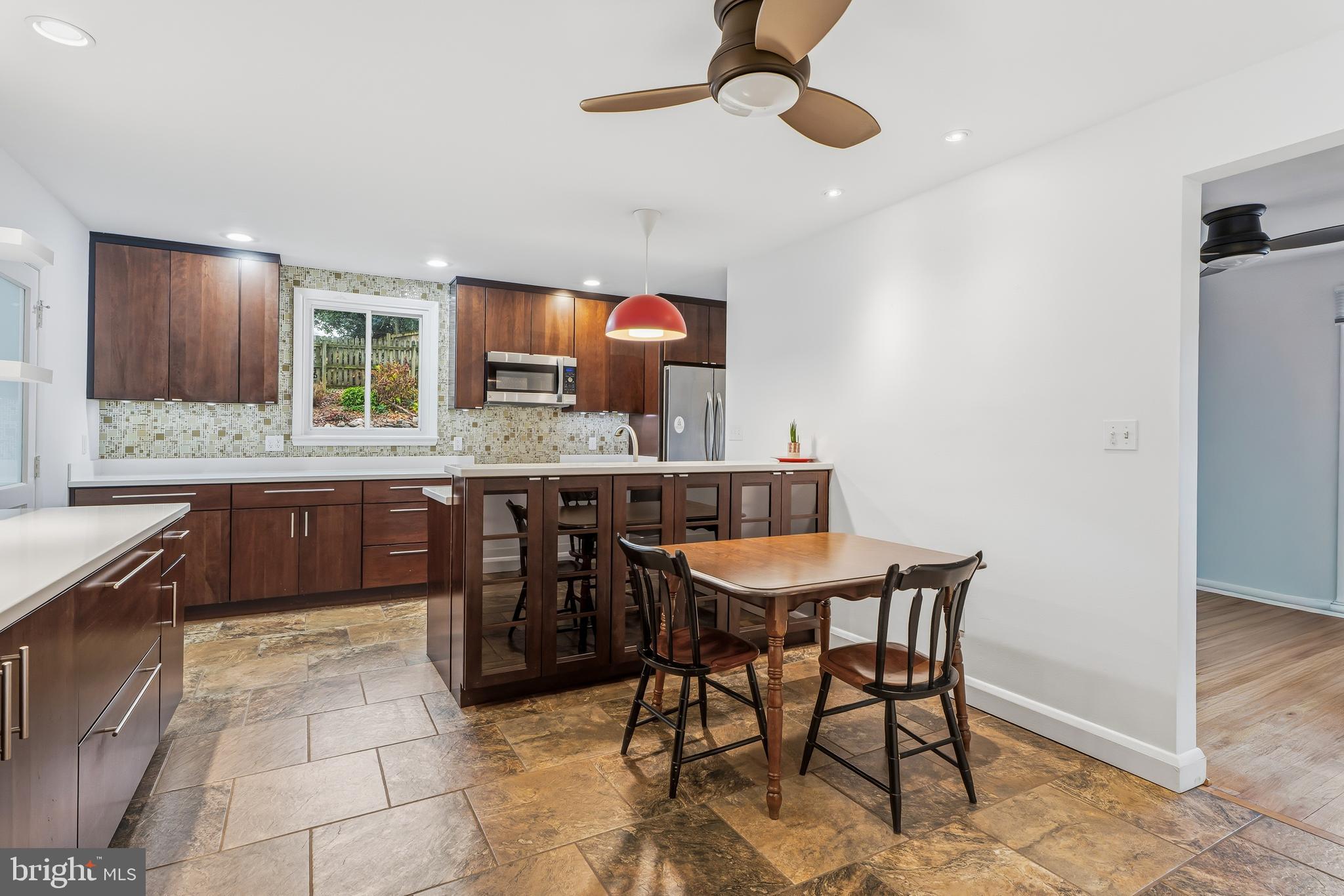 60 Belmore Road Lutherville-Timonium, MD 21093 - Photo 11 of 28 a kitchen with a table and chairs in it