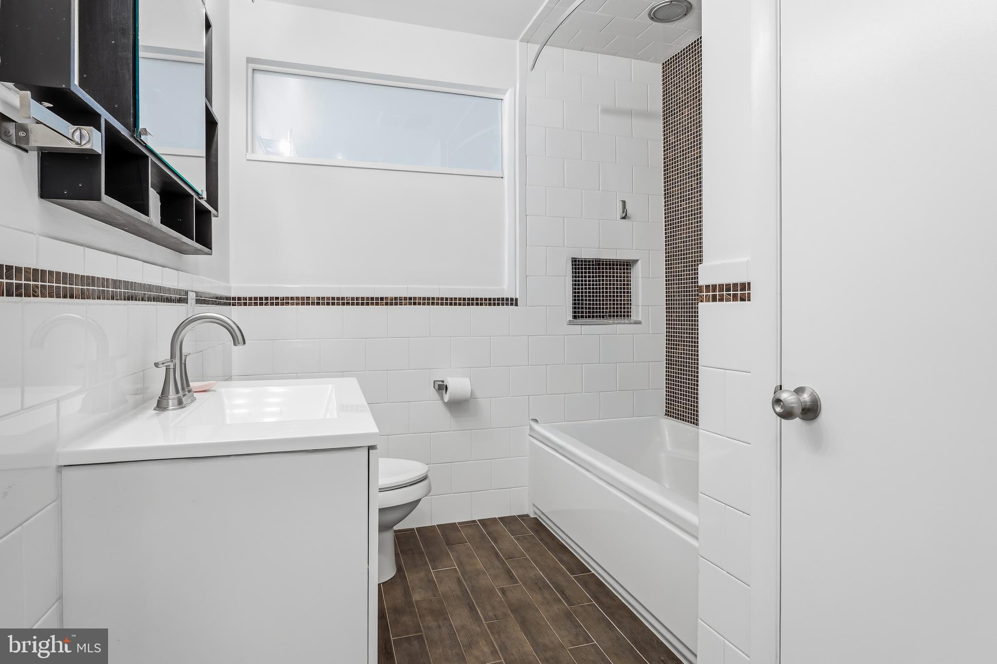 60 Belmore Road Lutherville-Timonium, MD 21093 - Photo 17 of 28 a bathroom with a sink a toilet and shower