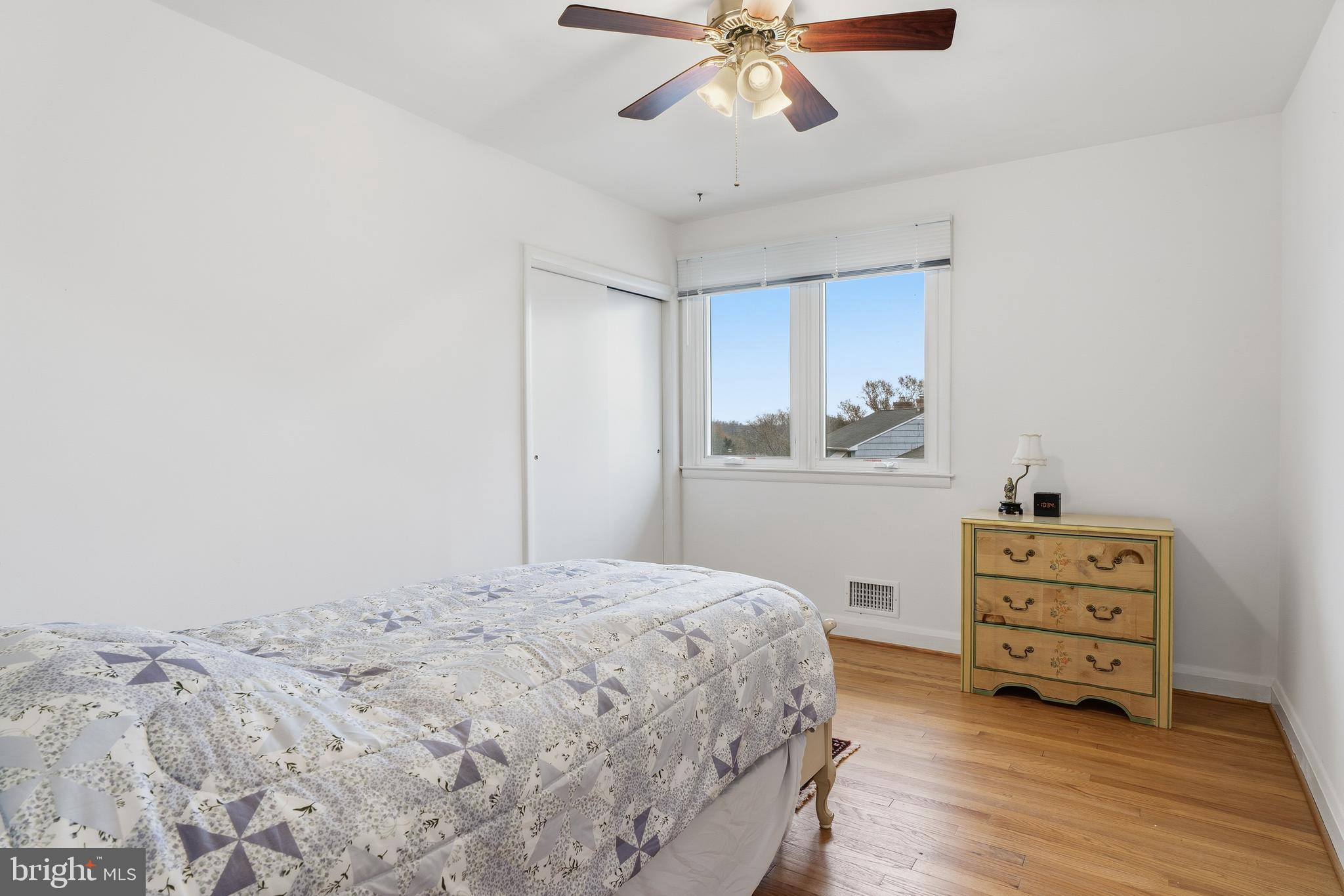 60 Belmore Road Lutherville-Timonium, MD 21093 - Photo 20 of 28 a bedroom with a bed and a chandelier