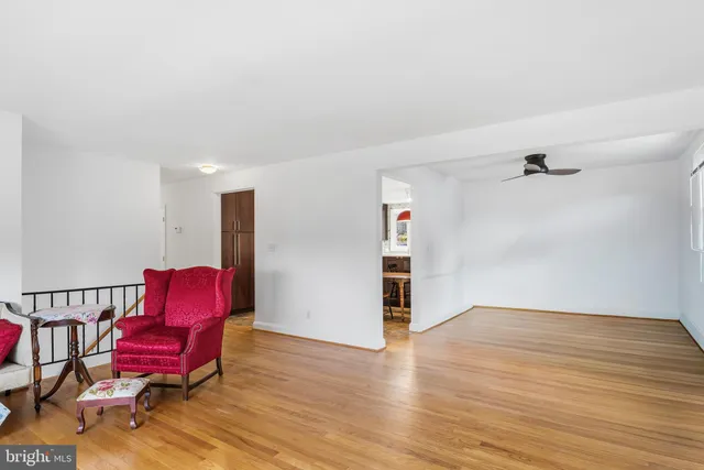 a view of a room with wooden floor
