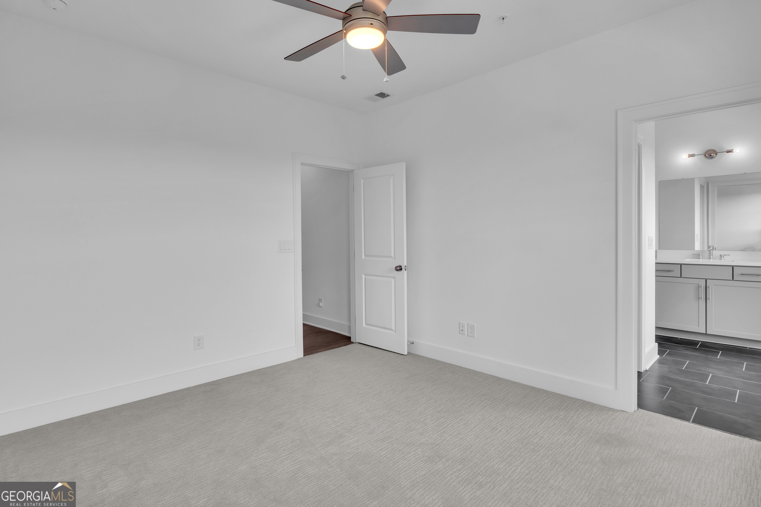 545 Whitlox Road Northwest Atlanta, GA 30309 - Photo 15 of 65 a view of an empty room and a chandelier fan