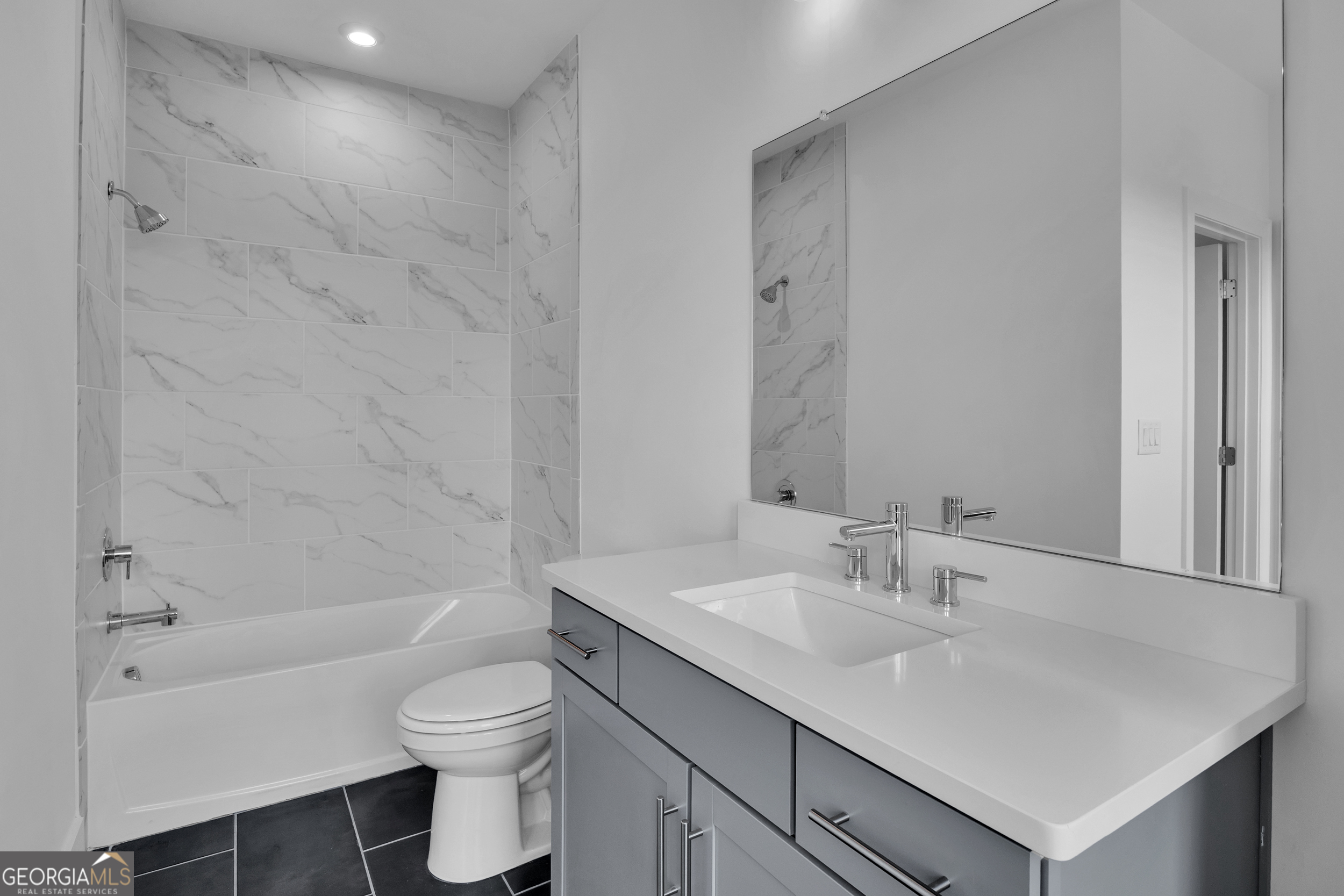 545 Whitlox Road Northwest Atlanta, GA 30309 - Photo 17 of 65 a bathroom with a sink a toilet and shower