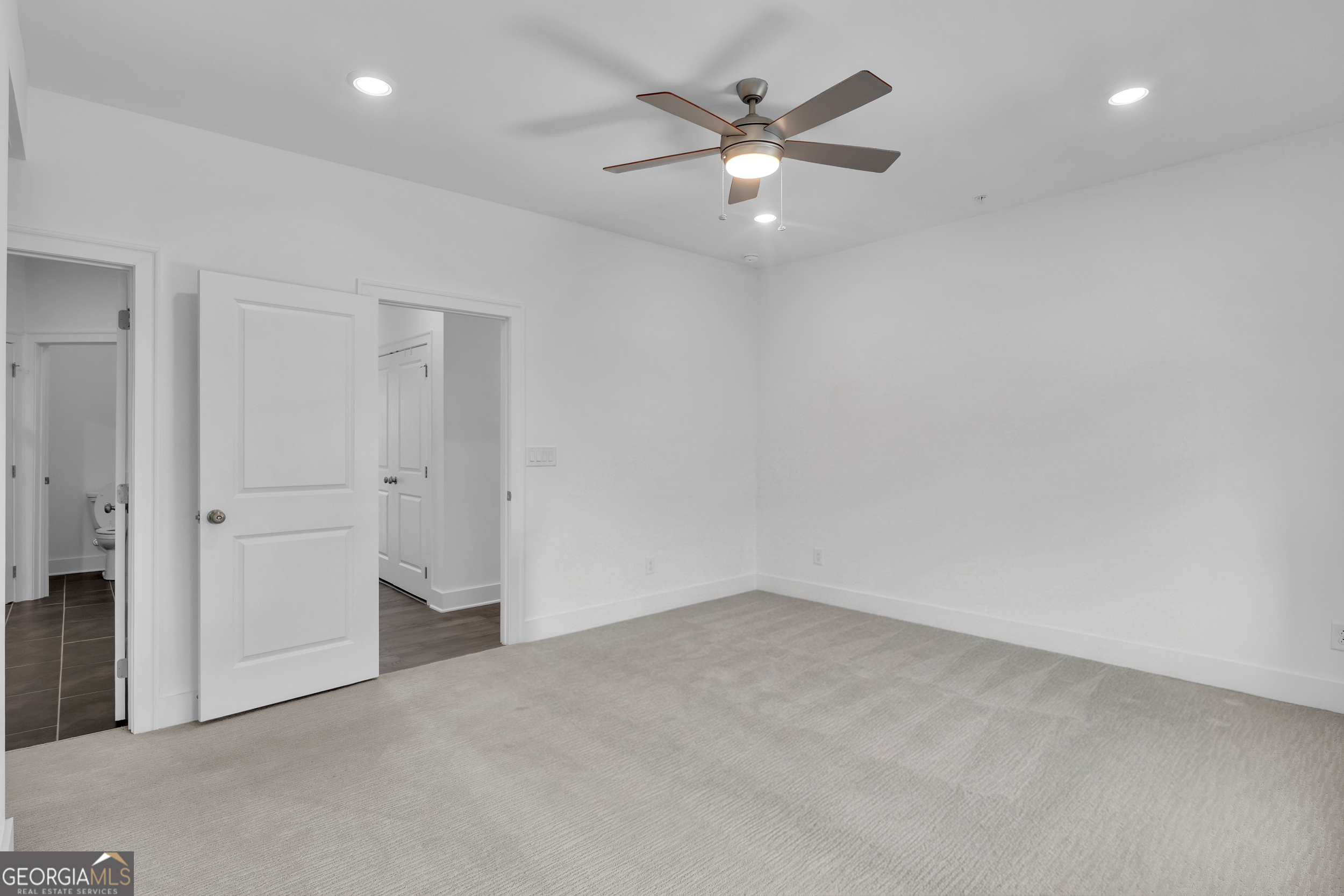 545 Whitlox Road Northwest Atlanta, GA 30309 - Photo 19 of 65 wooden floor in an empty room with a window