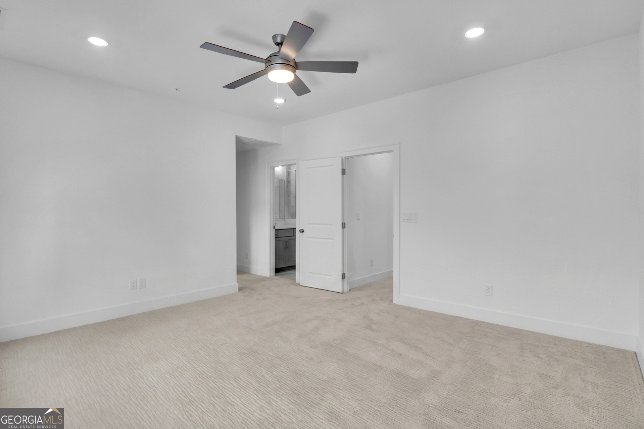 545 Whitlox Road Northwest Atlanta, GA 30309 - Photo 20 of 65 an empty room with a ceiling fan and a window