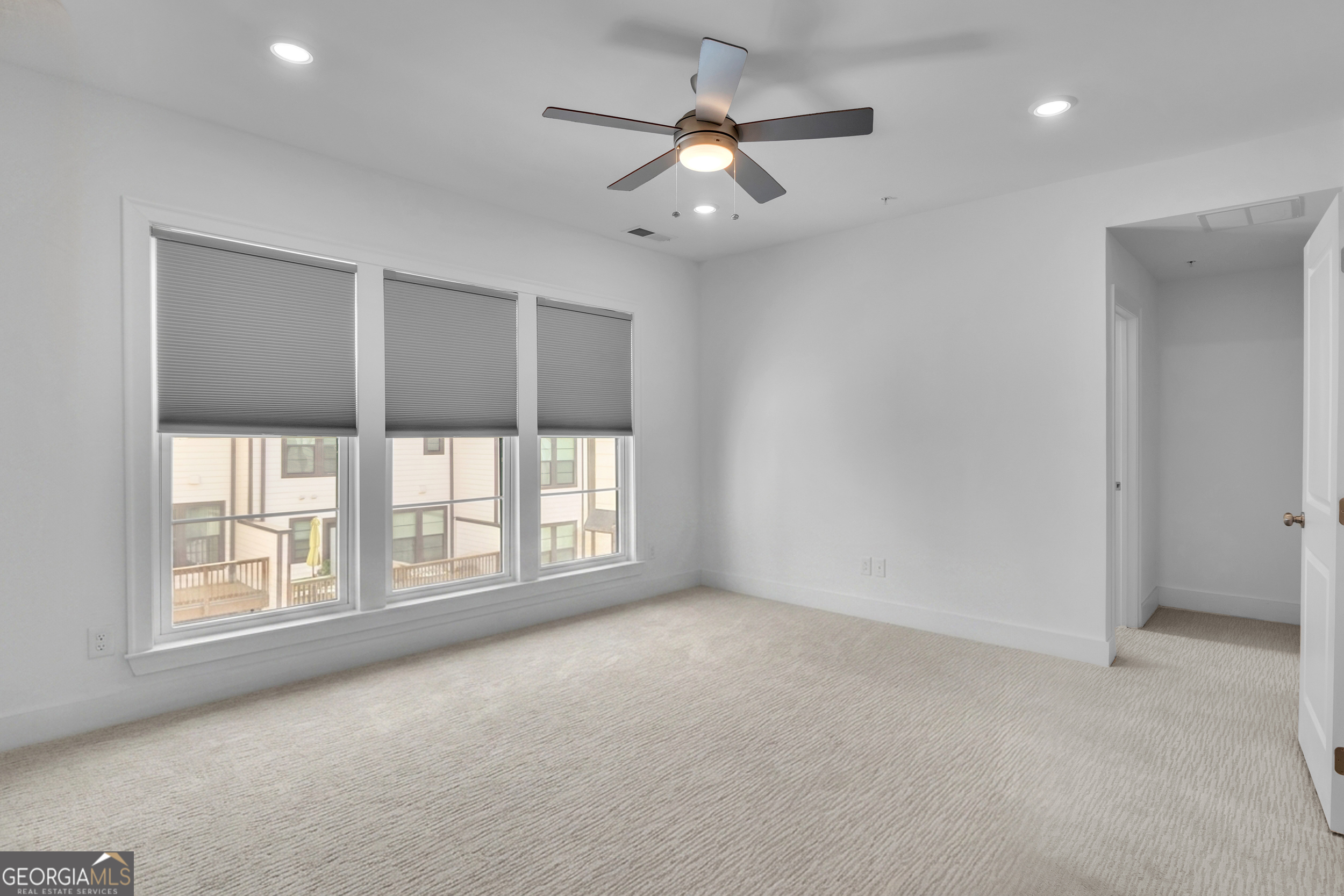 545 Whitlox Road Northwest Atlanta, GA 30309 - Photo 22 of 65 a view of an empty room with a window
