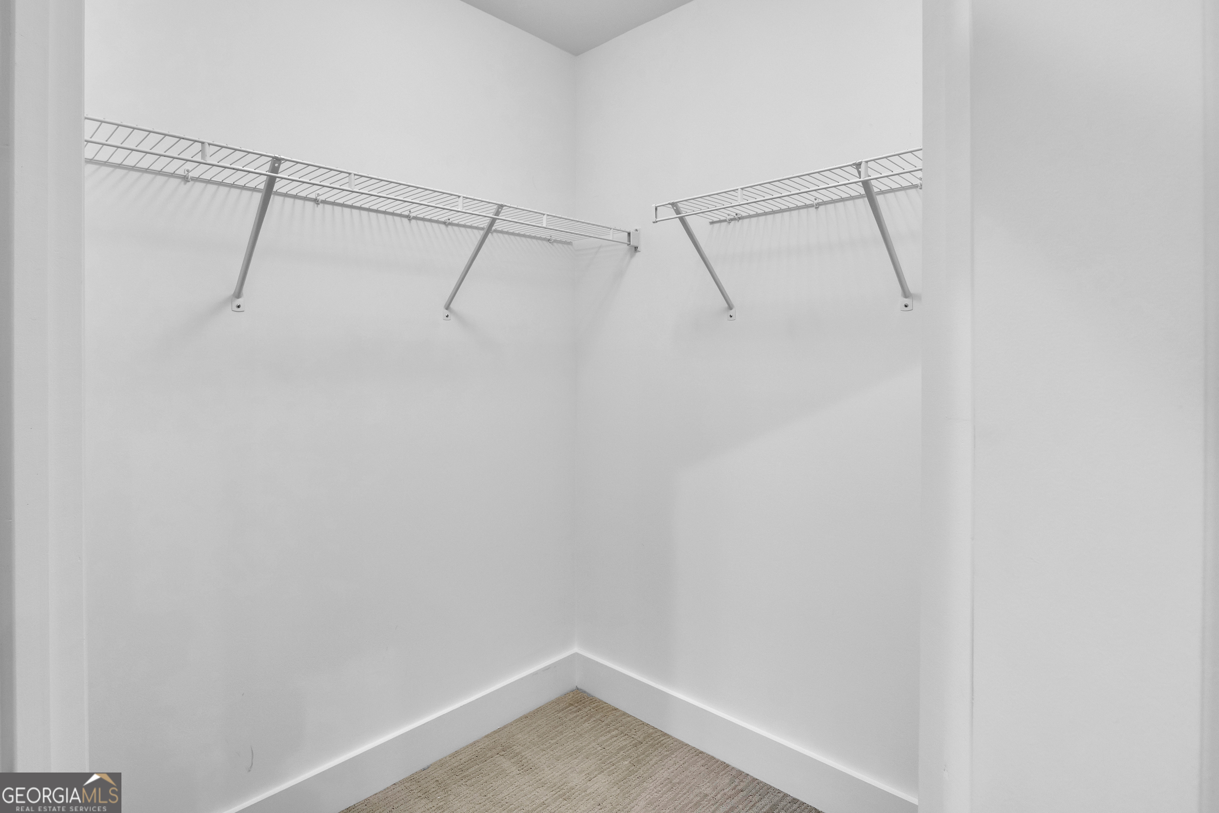 545 Whitlox Road Northwest Atlanta, GA 30309 - Photo 26 of 65 a view of a room with racks on the wall