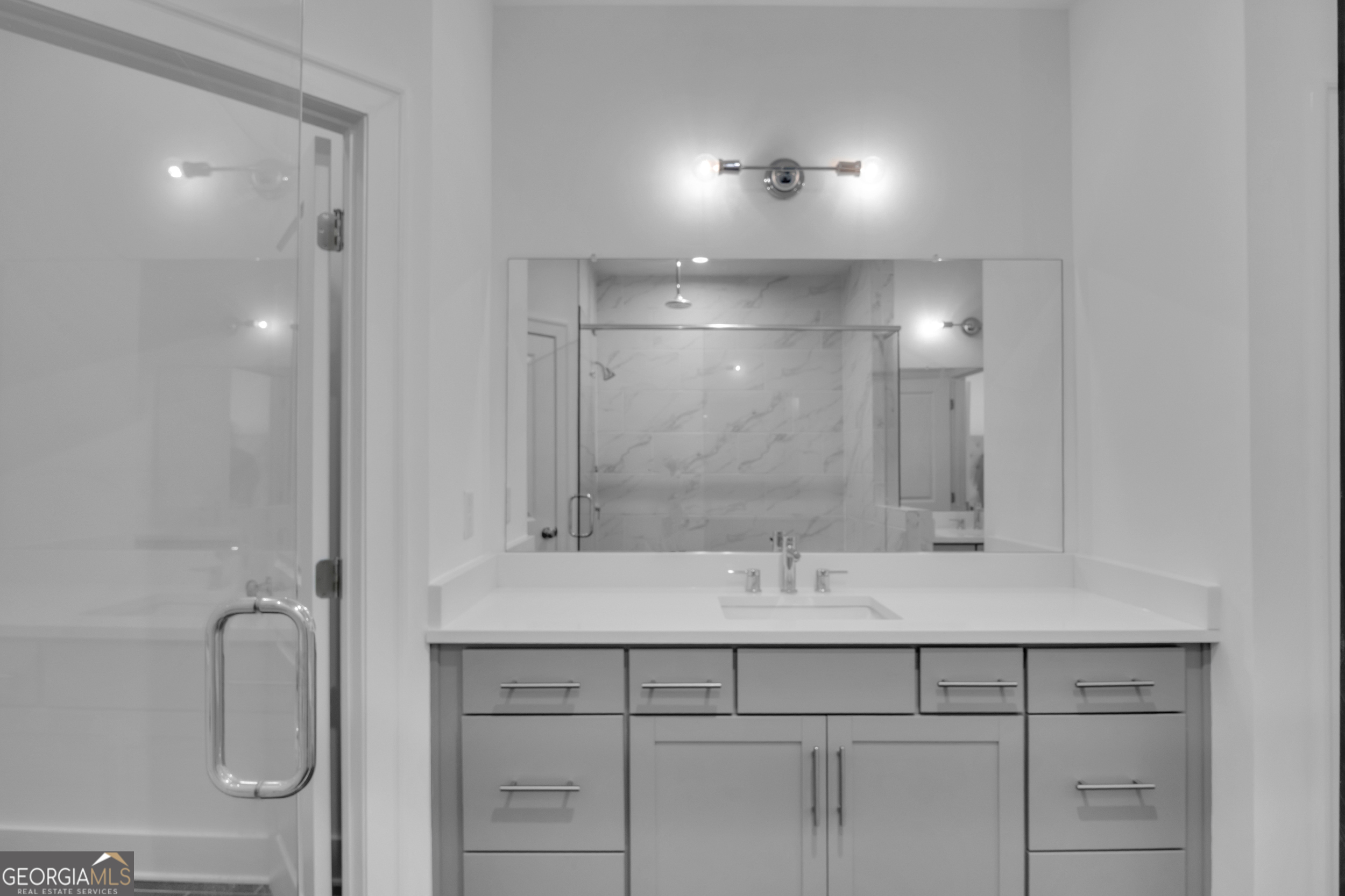 545 Whitlox Road Northwest Atlanta, GA 30309 - Photo 27 of 65 a bathroom with a sink shower and a mirror