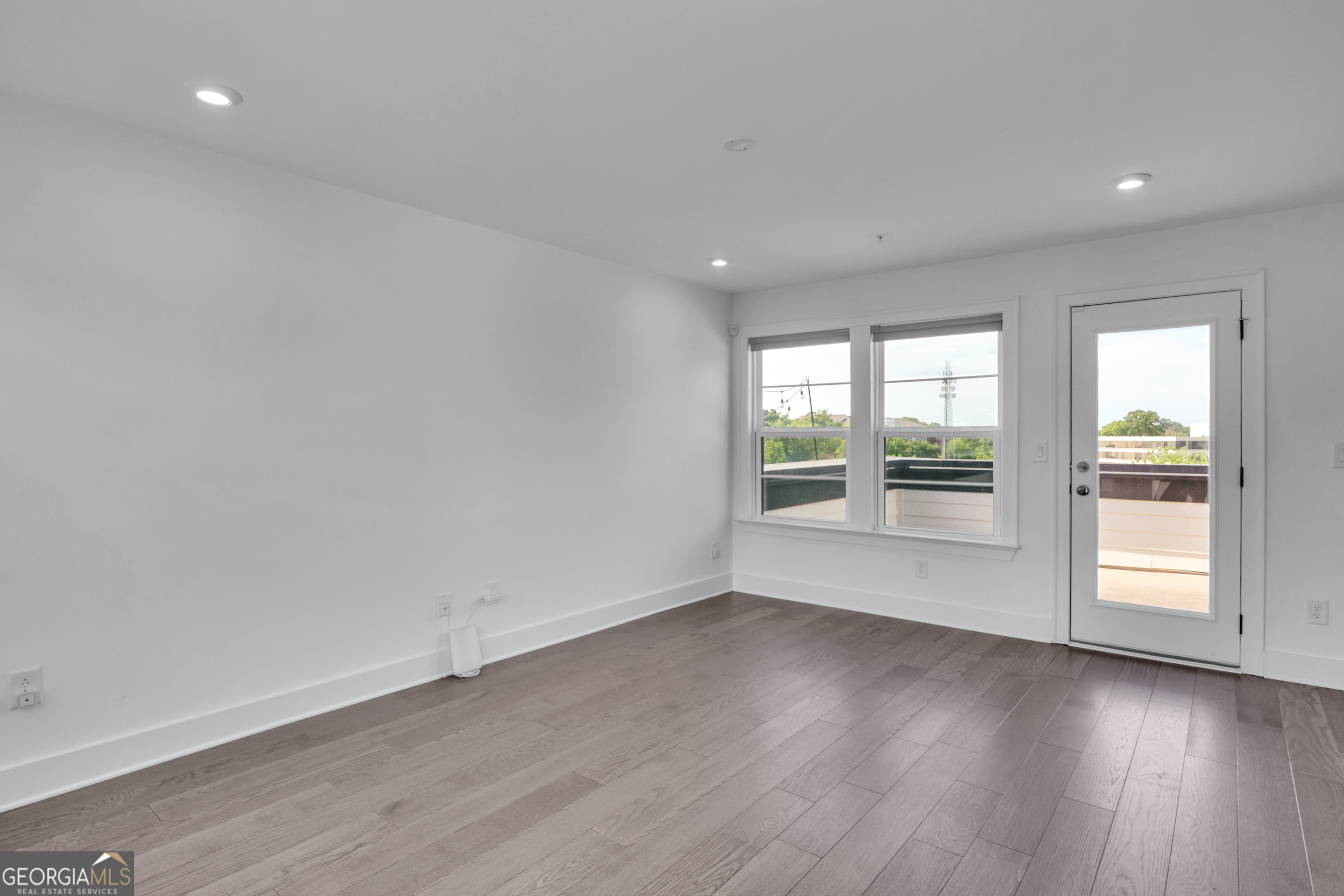 545 Whitlox Road Northwest Atlanta, GA 30309 - Photo 33 of 65 wooden floor in an empty room with a window
