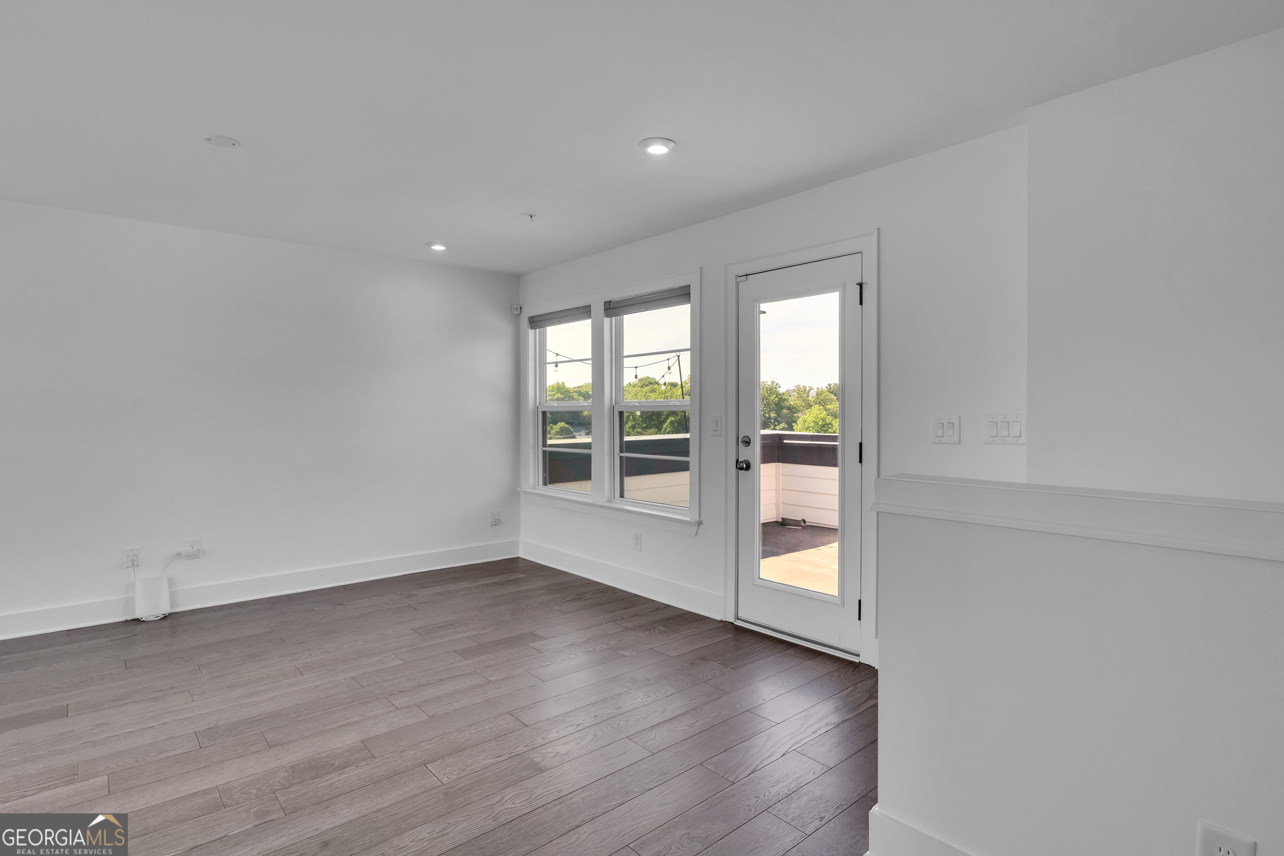 545 Whitlox Road Northwest Atlanta, GA 30309 - Photo 34 of 65 wooden floor in an empty room with a window