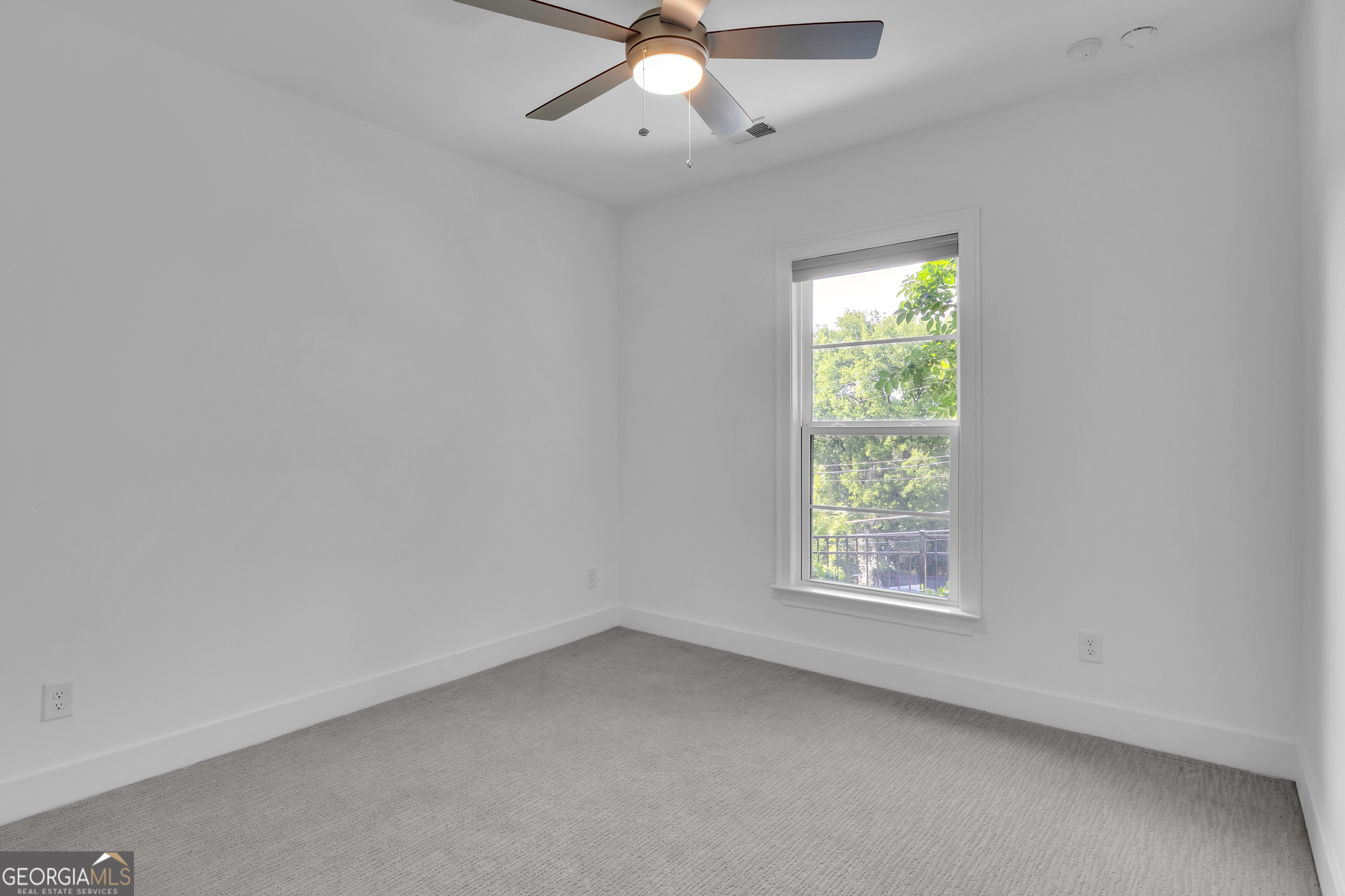 545 Whitlox Road Northwest Atlanta, GA 30309 - Photo 46 of 65 an empty room with a window