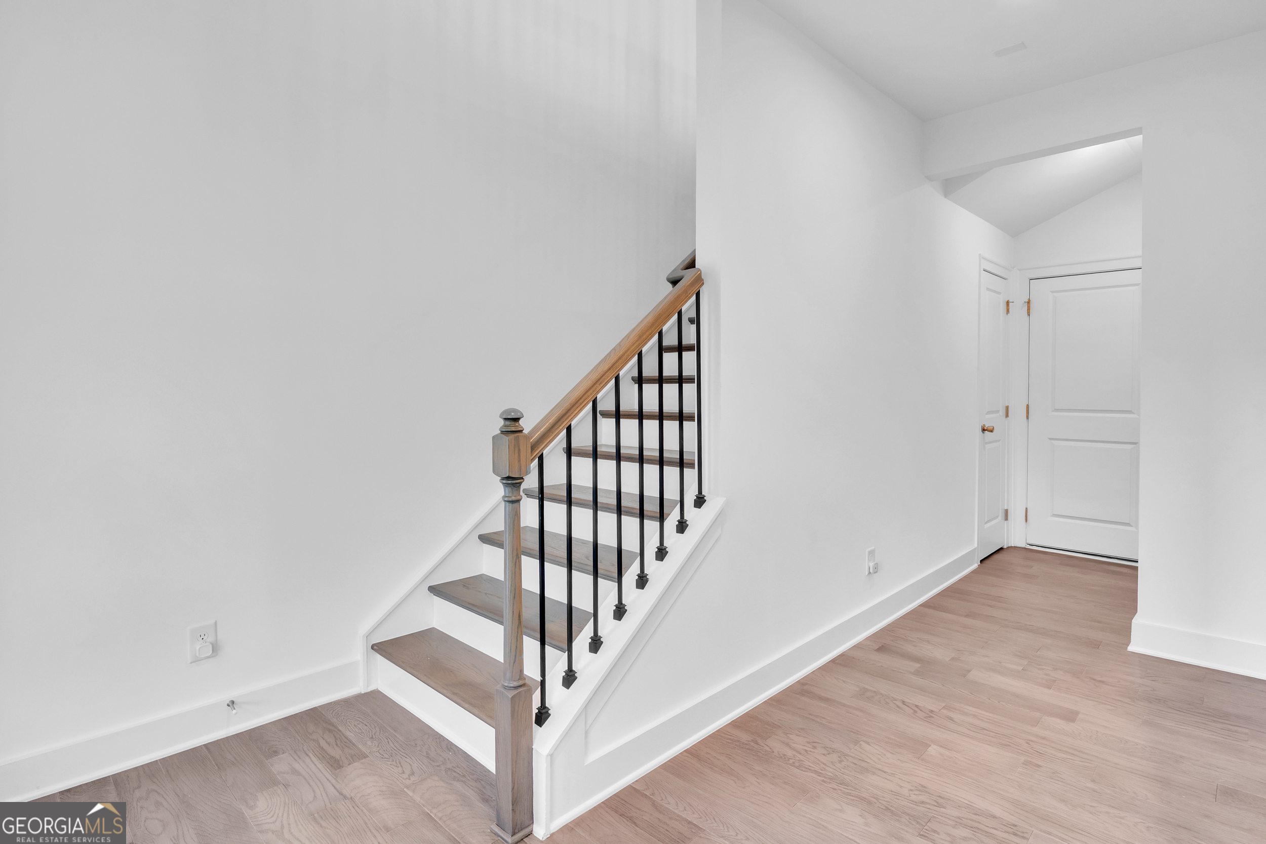 545 Whitlox Road Northwest Atlanta, GA 30309 - Photo 51 of 65 wooden floor in a hall with a window