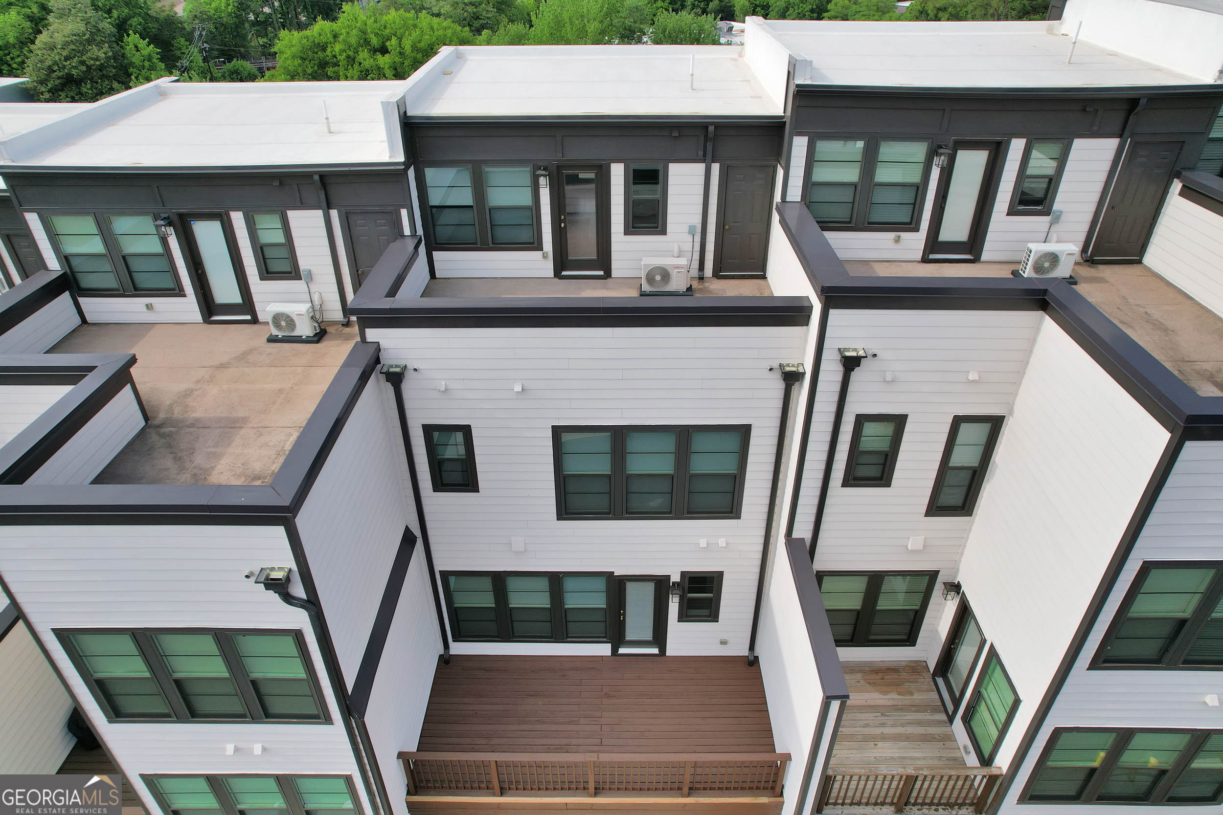 545 Whitlox Road Northwest Atlanta, GA 30309 - Photo 58 of 65 an aerial view of a house with balcony and furniture