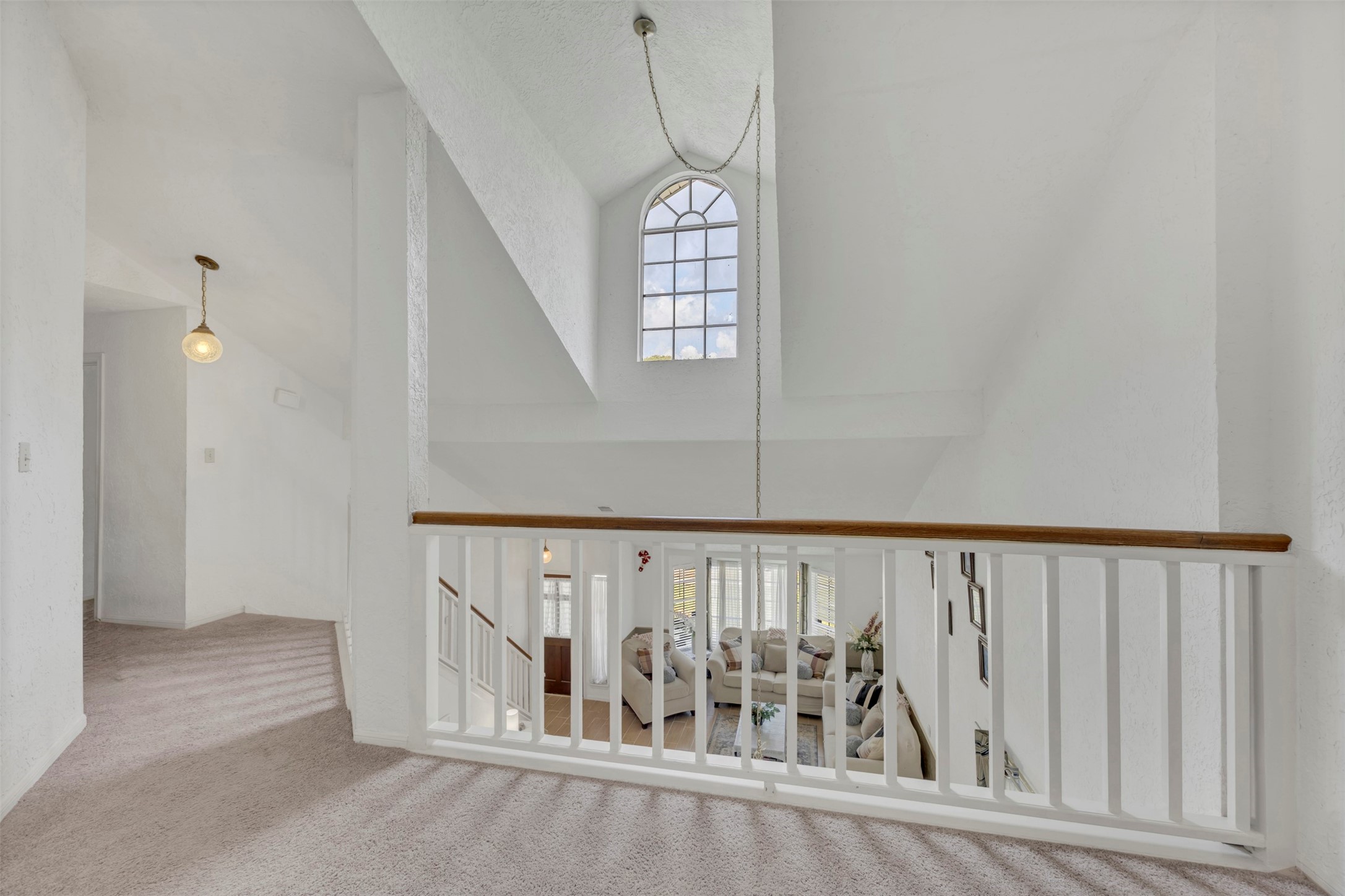 15619 Beechnut Street Houston, TX 77083 - Photo 28 of 29 Open railing overlooks the main living area, adding architectural interest and natural light.