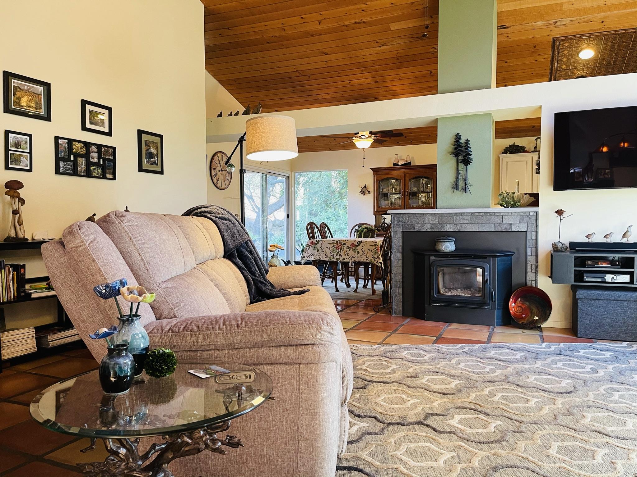 40964 Cherokee Oaks Drive Three Rivers, CA 93271 - Photo 13 of 41 a living room with furniture and a fireplace