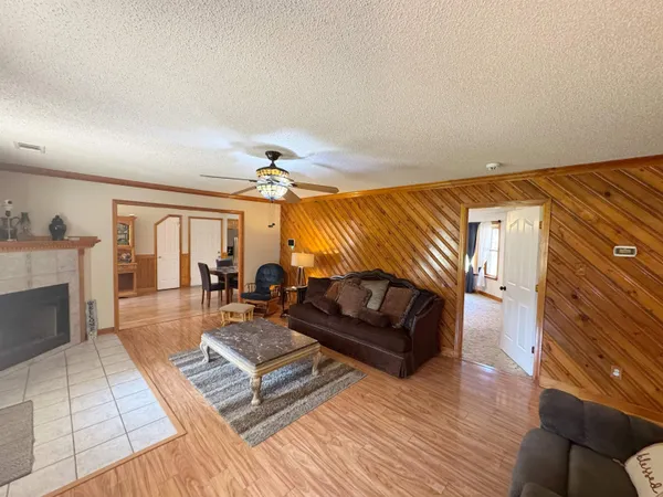 a spacious bedroom with a bed and a couch