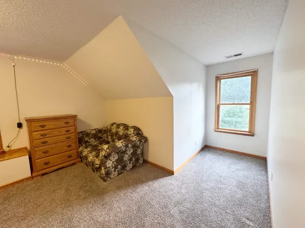 a view of a big room with windows