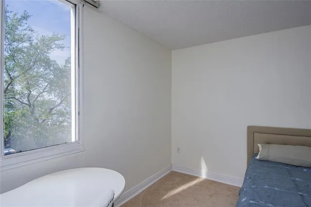 a bathroom with a sink toilet and mirror