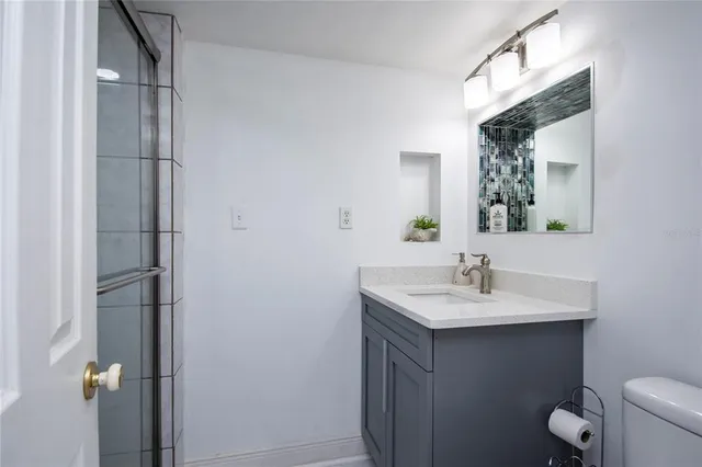 a living room with furniture a flat screen tv and a large window