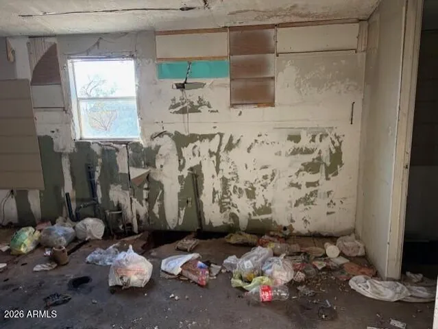 a bathroom with a toilet sink and shower curtain