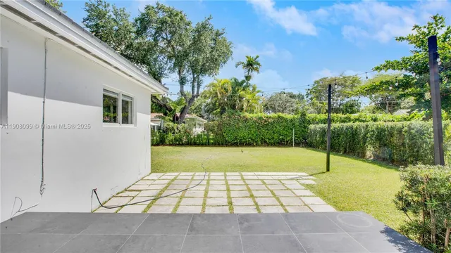 a view of swimming pool with yard