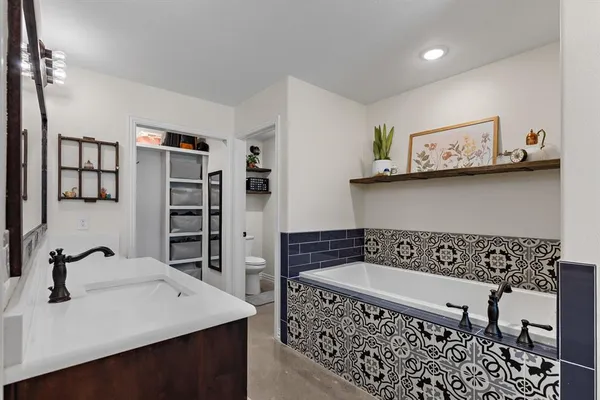a kitchen with a sink and a refrigerator