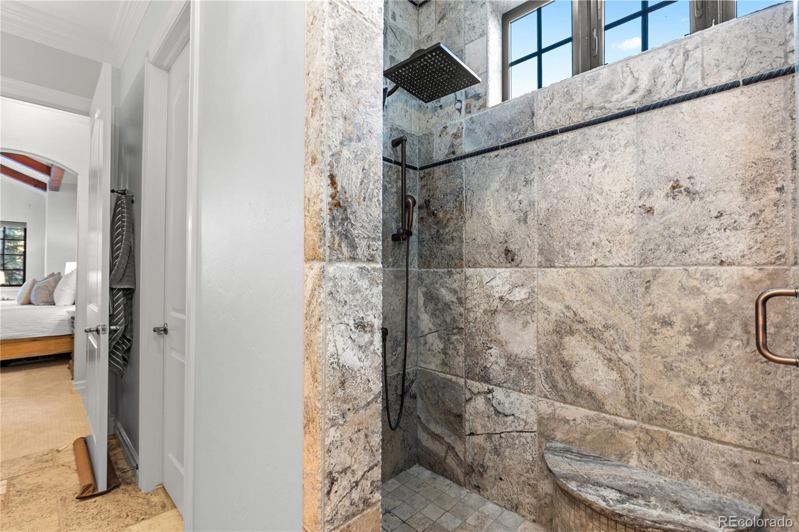 1033 Buffalo Ridge Road Castle Pines, CO 80108 - Photo 20 of 43 a bathroom with a shower