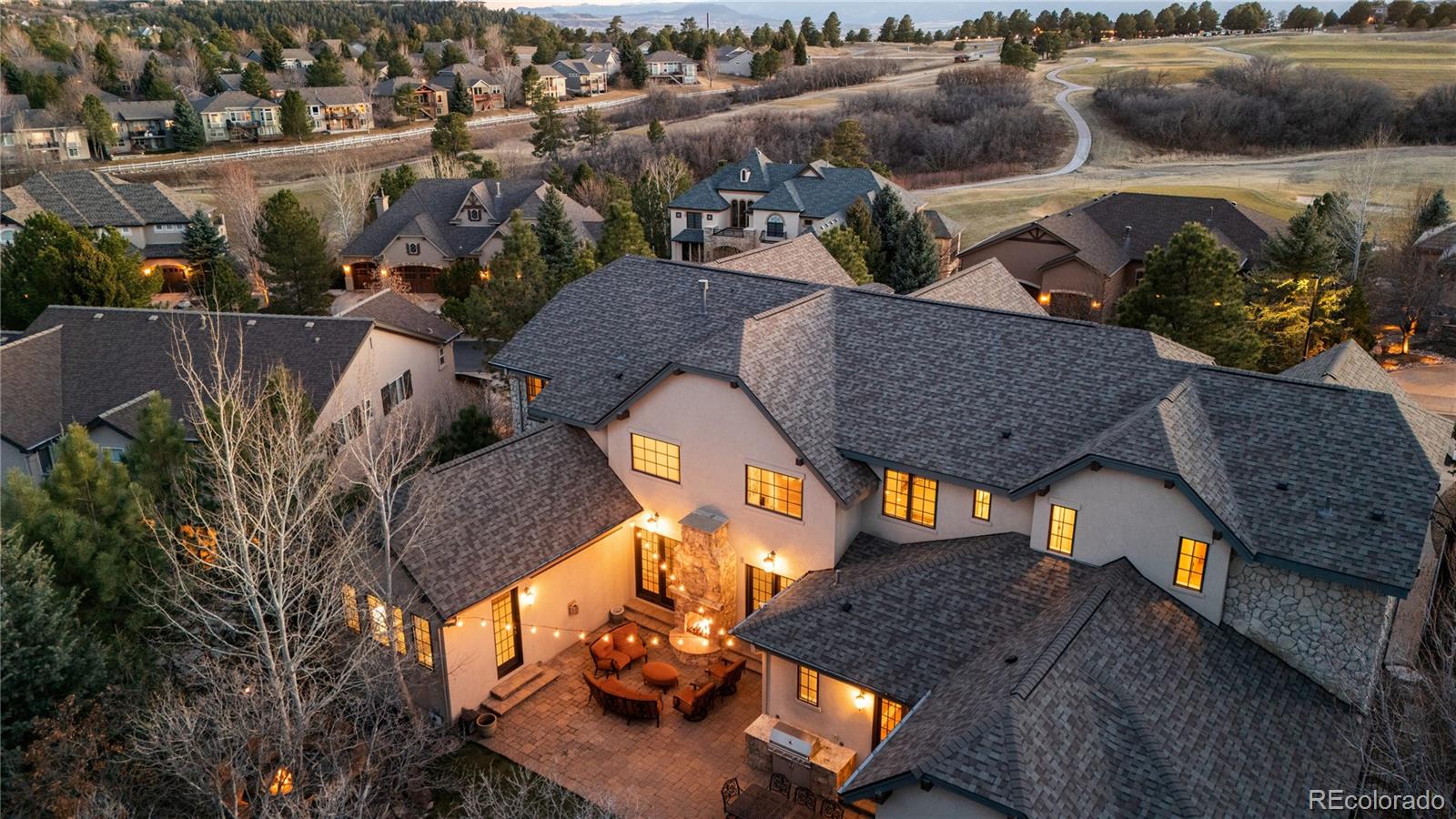 1033 Buffalo Ridge Road Castle Pines, CO 80108 - Photo 2 of 43 an aerial view of a house with garden space and sitting space