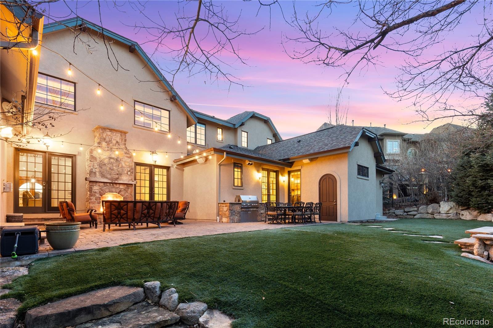 1033 Buffalo Ridge Road Castle Pines, CO 80108 - Photo 39 of 43 a front view of a building with a garden