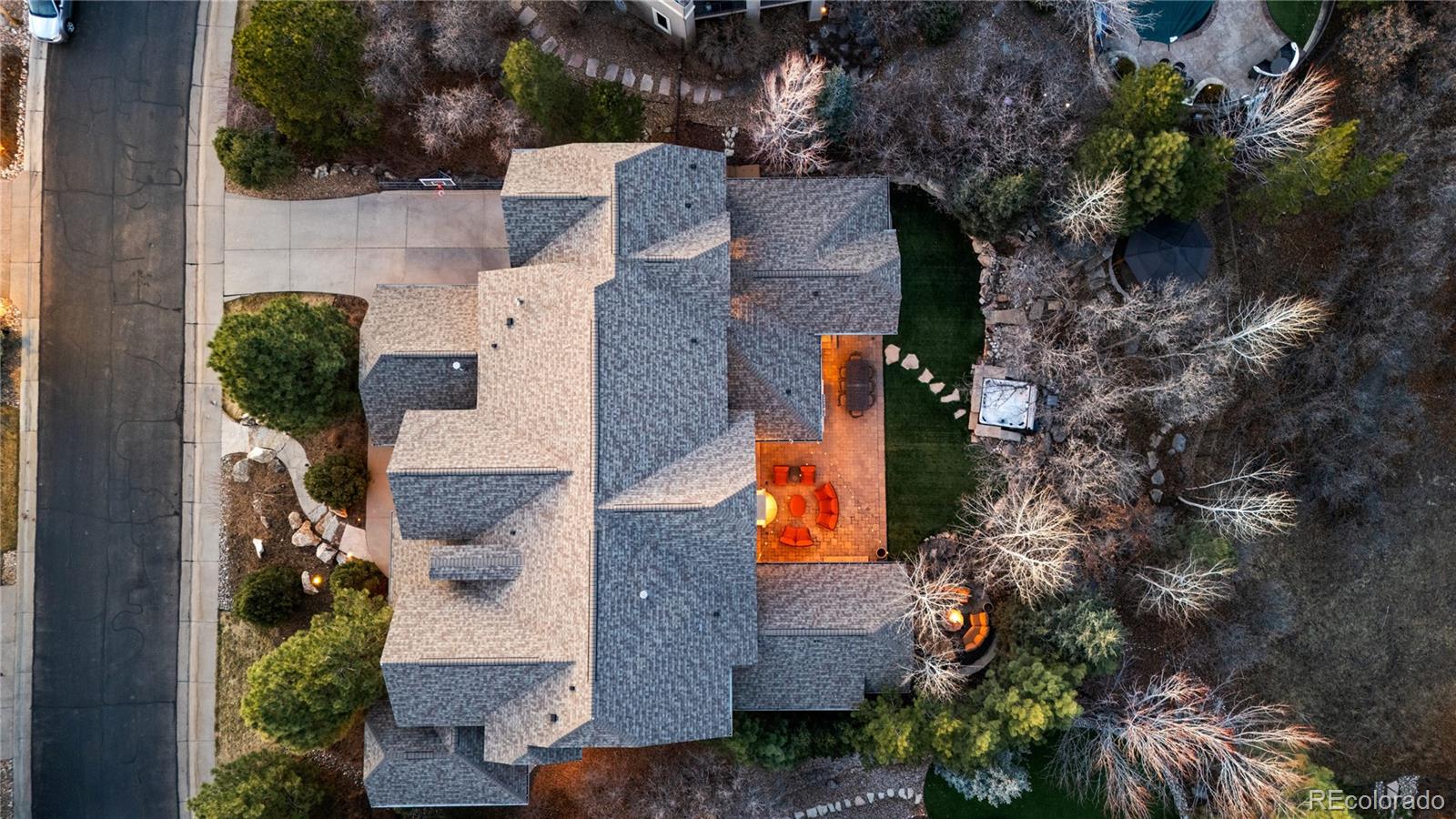1033 Buffalo Ridge Road Castle Pines, CO 80108 - Photo 41 of 43 an aerial view of house with yard