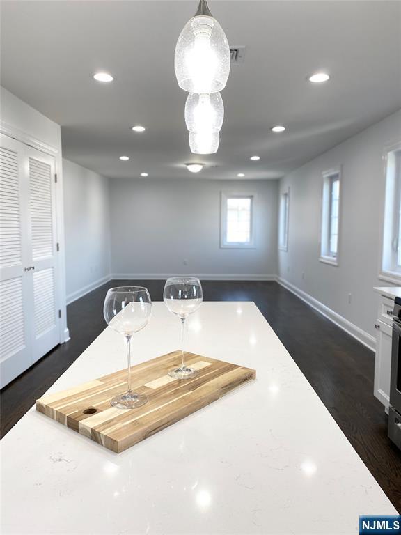 61 Chestnut Street, Unit 2 Lodi, NJ 07644 - Photo 10 of 22 a room with a chandelier and wooden floor