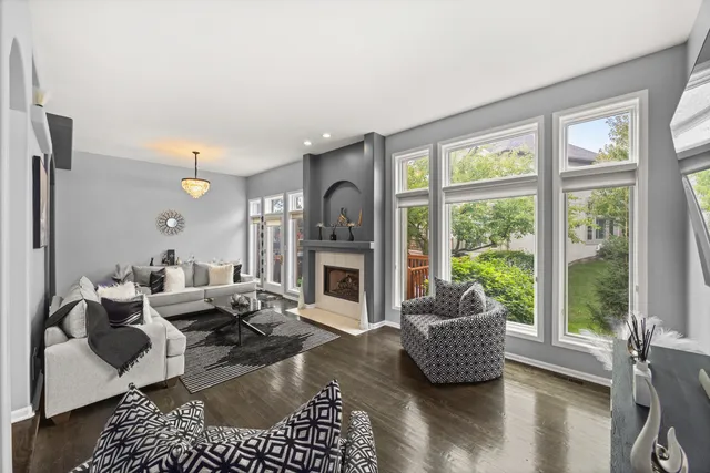 a living room with furniture and a fireplace