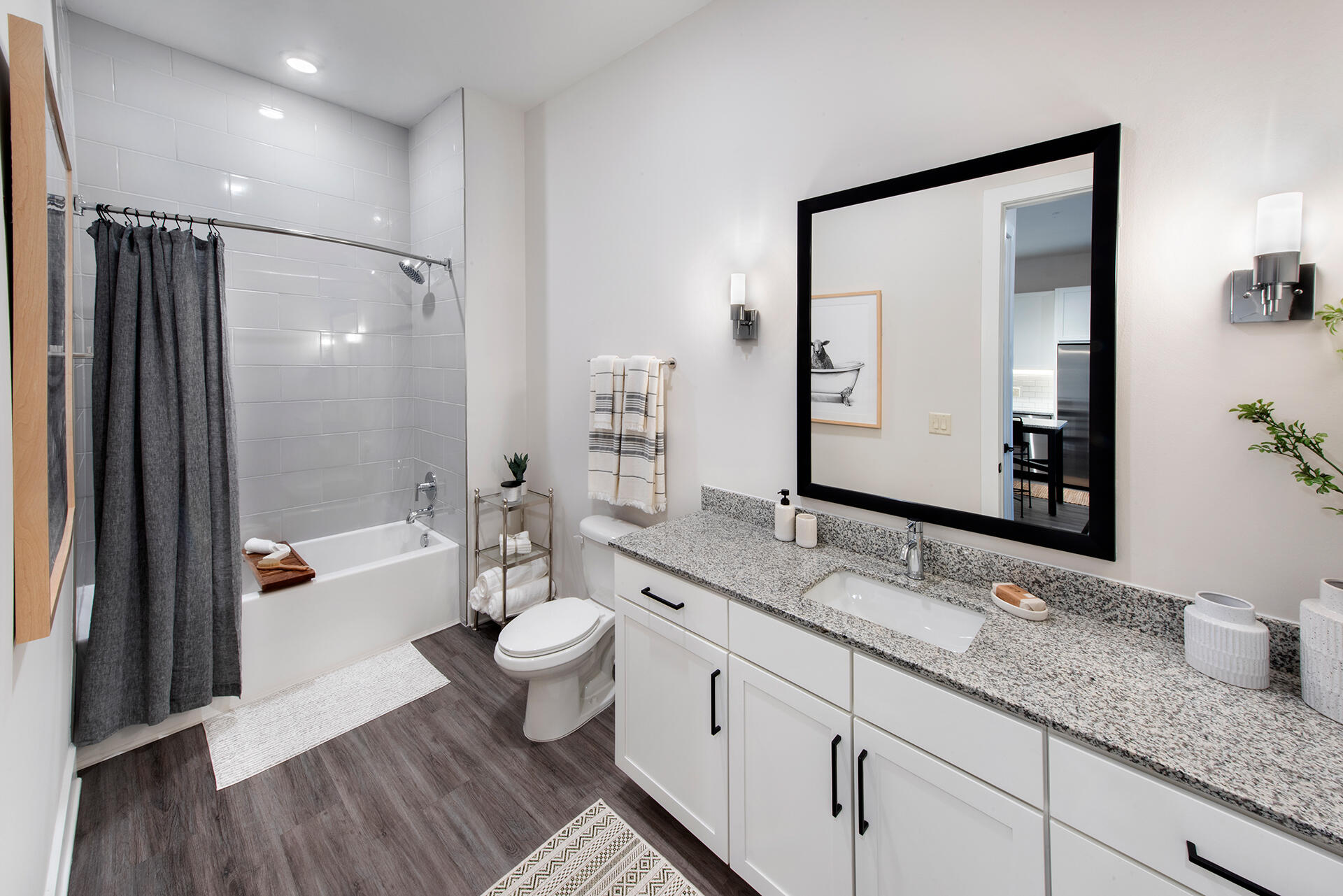 2000 Stirling Road, Unit 7106 Hollywood, FL 33020 - Photo 14 of 18 a spacious bathroom with a granite countertop sink a toilet a mirror and shower