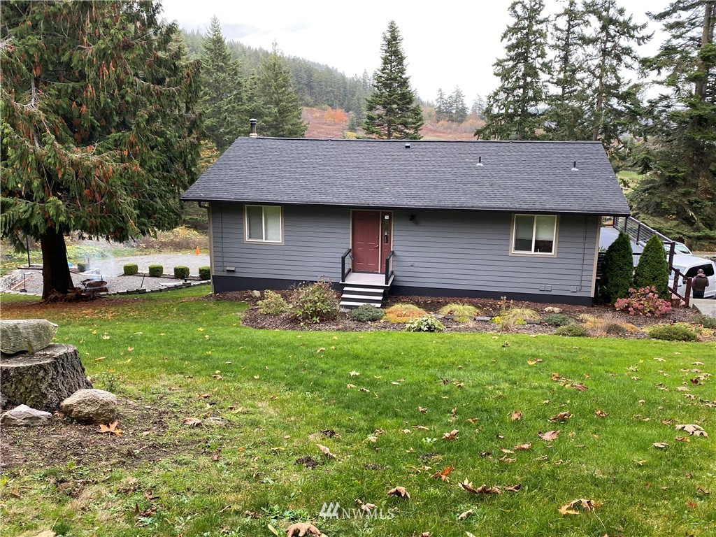 13586 Donnell Road Anacortes, WA 98221 - Photo 14 of 14 a front view of a house with a yard and trees