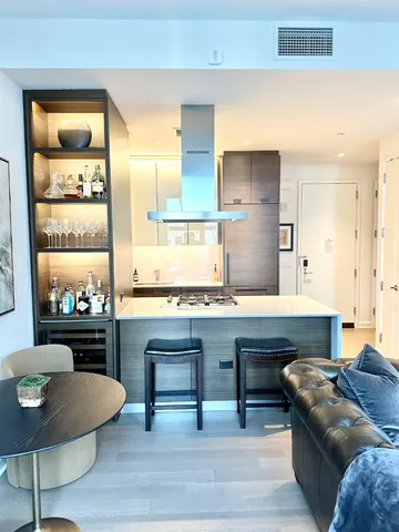 a living room with furniture rug and window