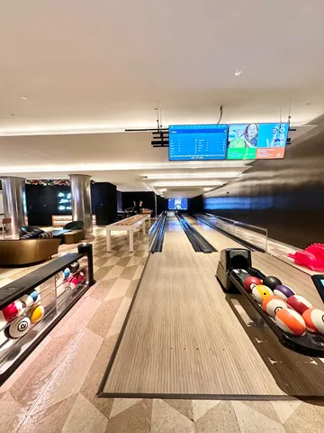 a lobby with furniture and a flat screen tv