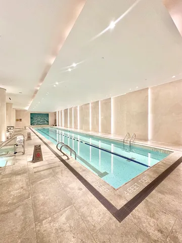 a view of a kitchen with a table and chairs