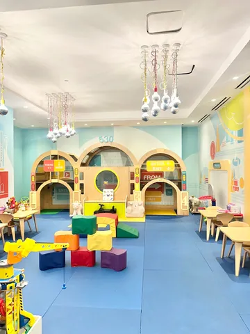 a living room with furniture and pool table