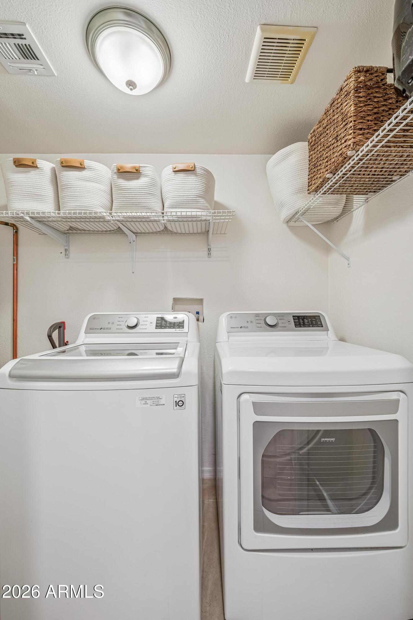 2327 East Weldon Avenue Phoenix, AZ 85016 - Photo 12 of 34 a utility room with dryer and washer