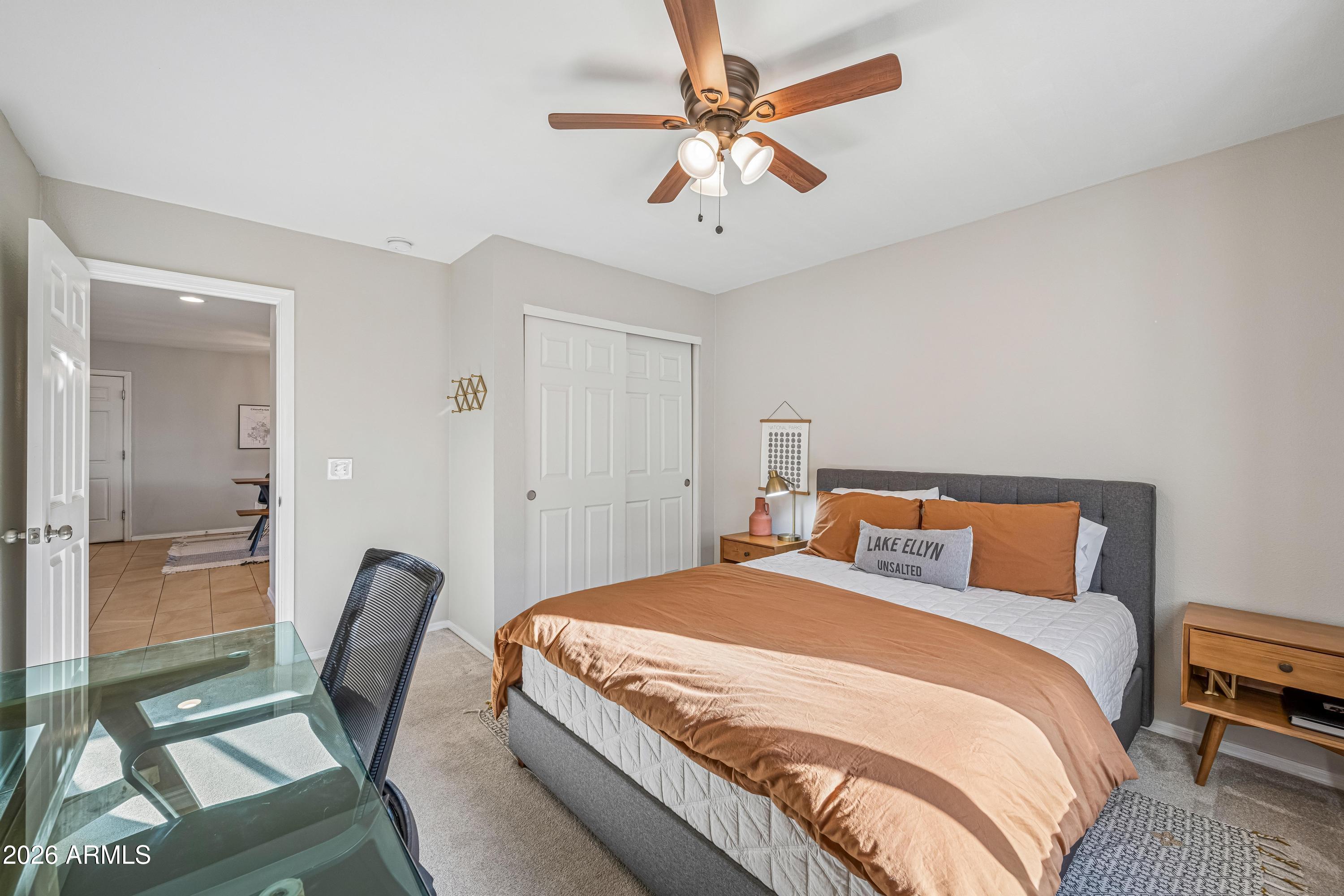 2327 East Weldon Avenue Phoenix, AZ 85016 - Photo 14 of 34 a bedroom with a bed and a chandelier