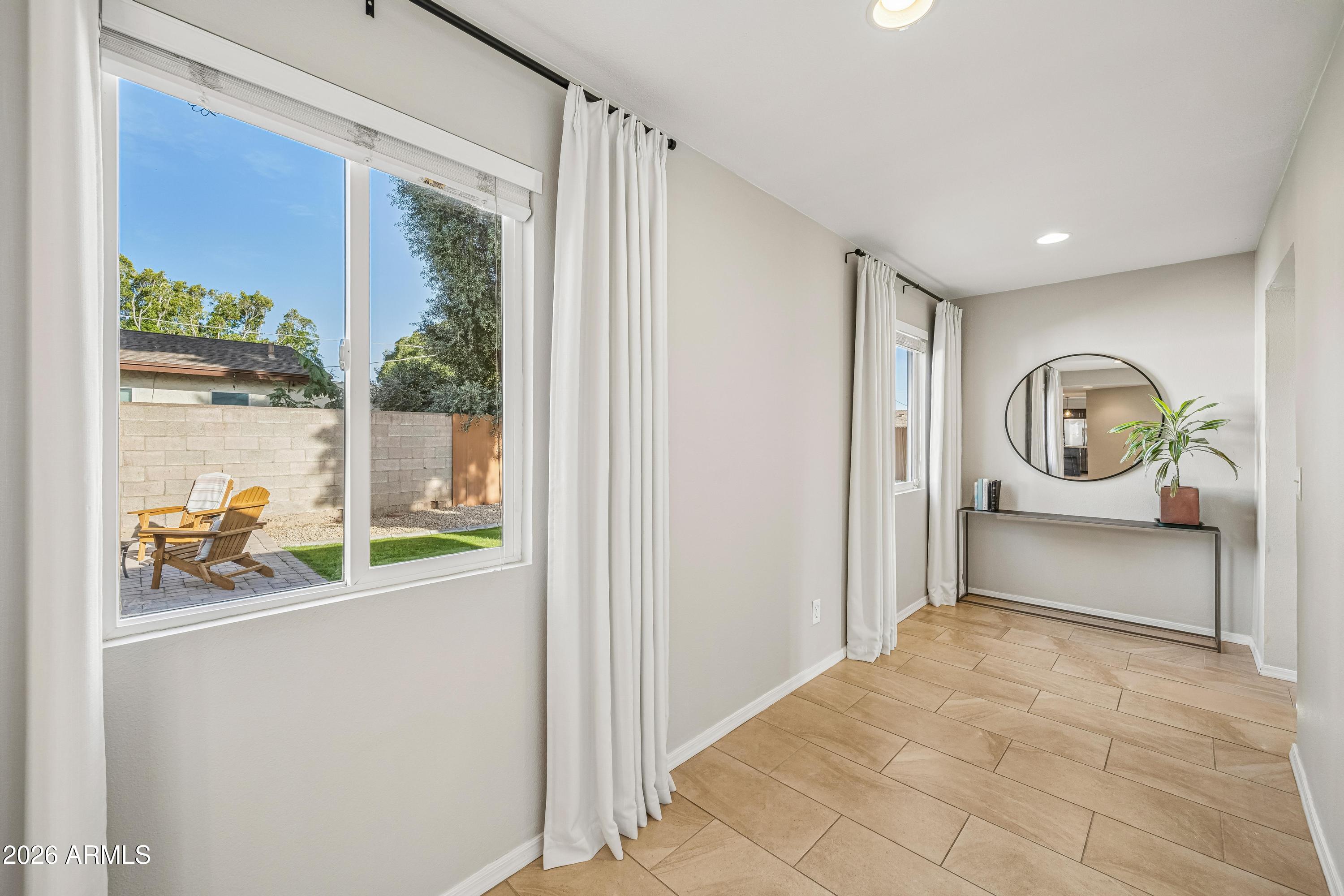 2327 East Weldon Avenue Phoenix, AZ 85016 - Photo 17 of 34 a view of a hallway to a livingroom with furniture