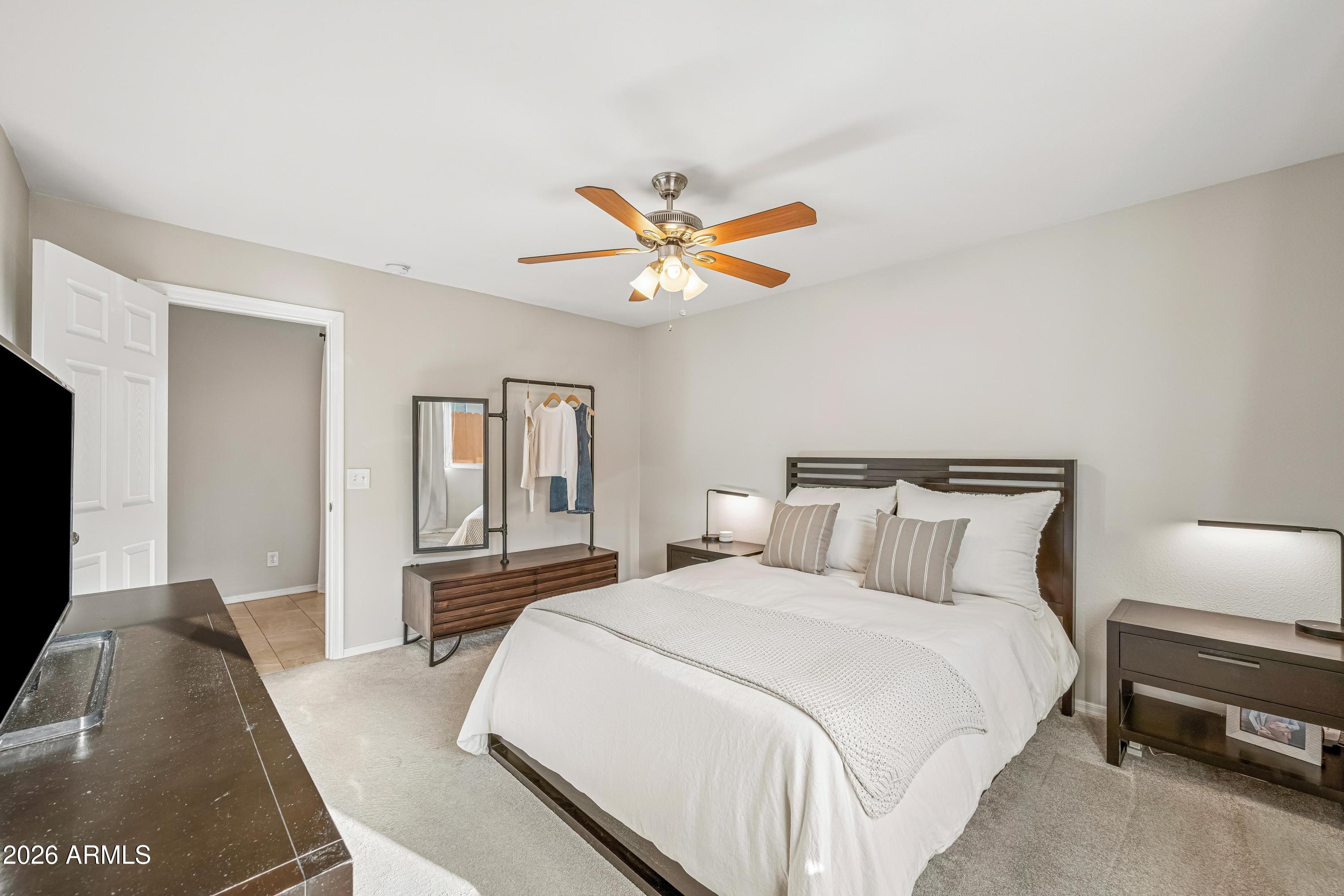 2327 East Weldon Avenue Phoenix, AZ 85016 - Photo 19 of 34 a bedroom with a bed and a couch