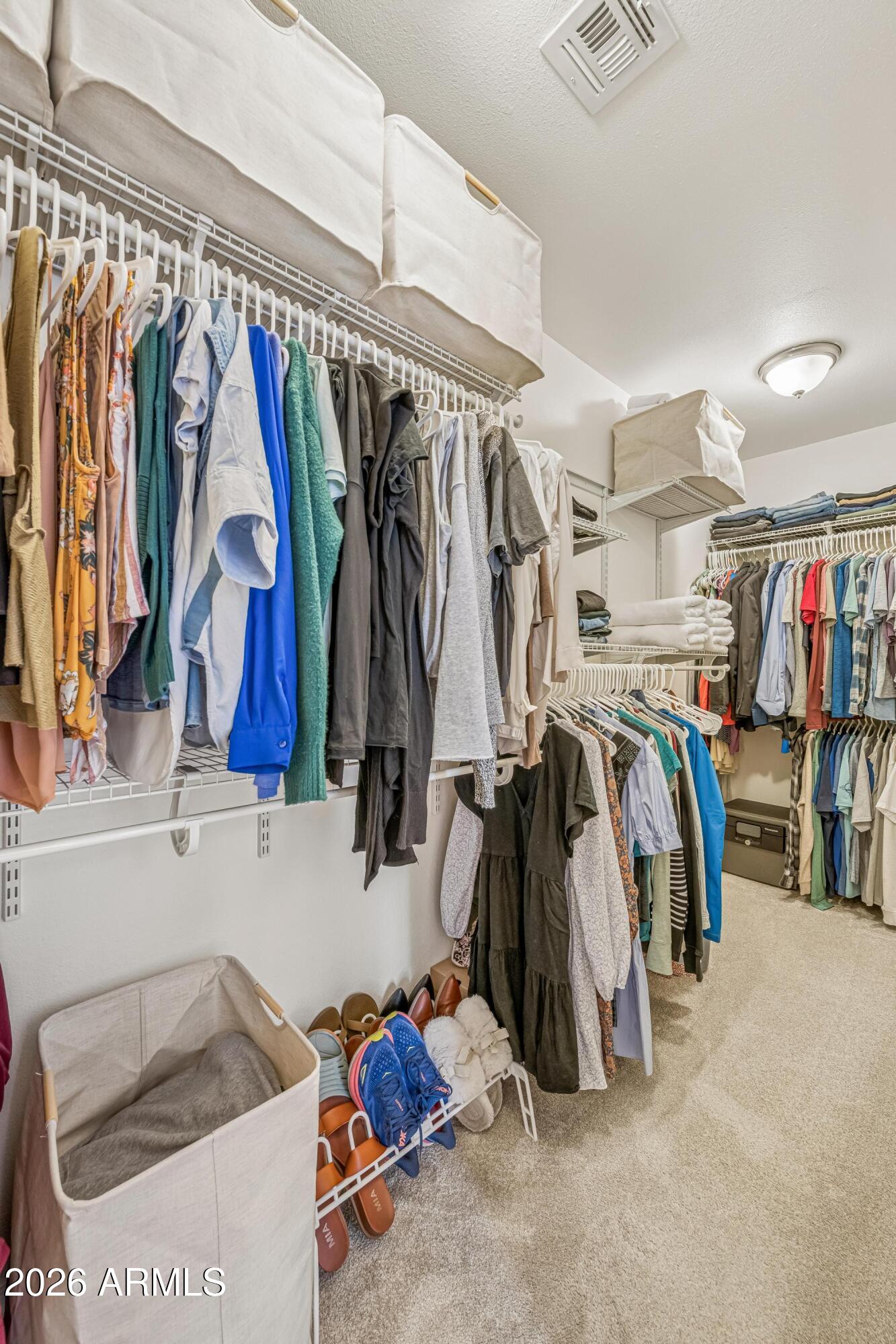 2327 East Weldon Avenue Phoenix, AZ 85016 - Photo 22 of 34 a view of walk in closet with clothes and shoes