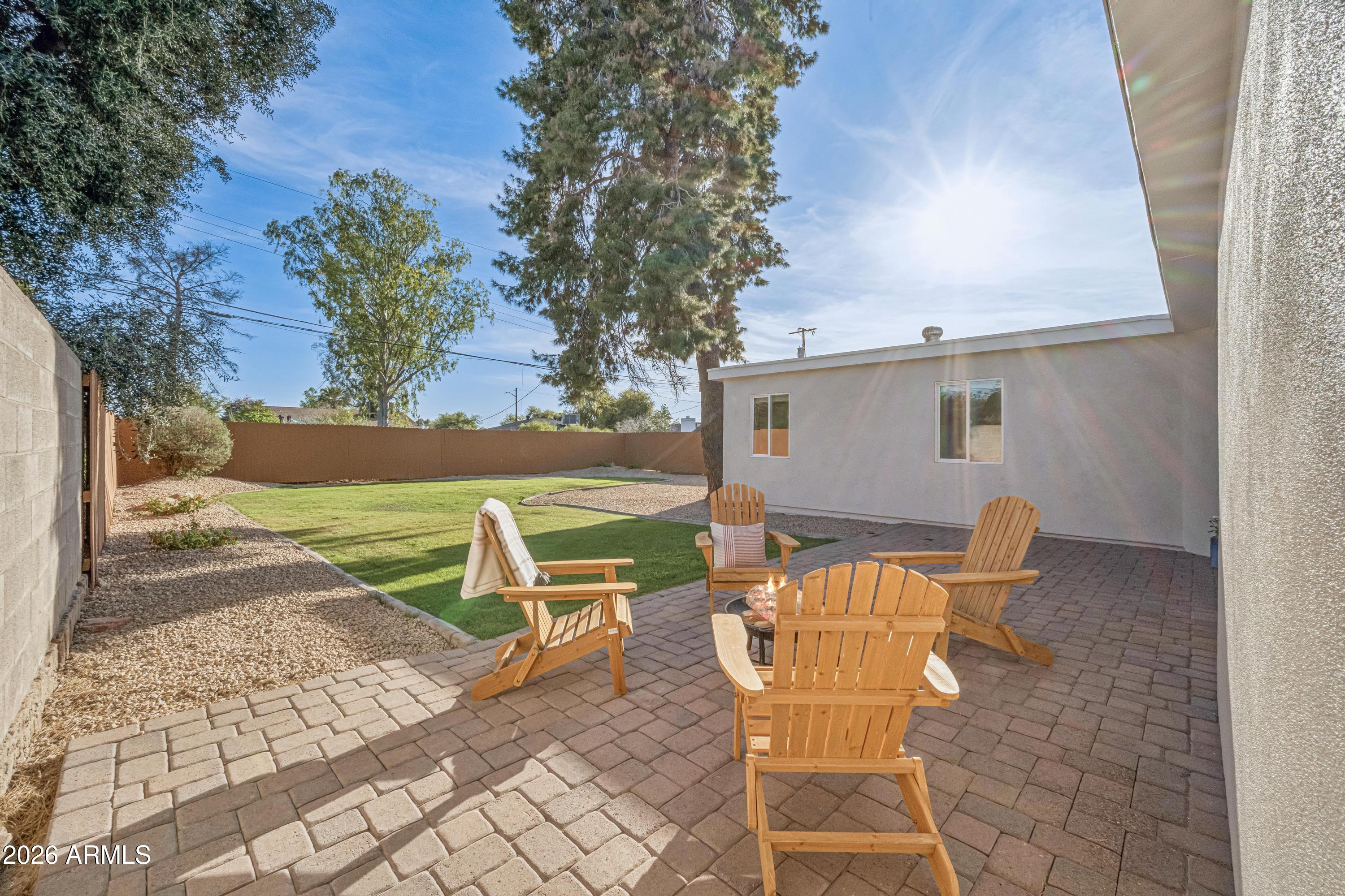 2327 East Weldon Avenue Phoenix, AZ 85016 - Photo 25 of 34 a view of a patio with table and chairs and potted plants