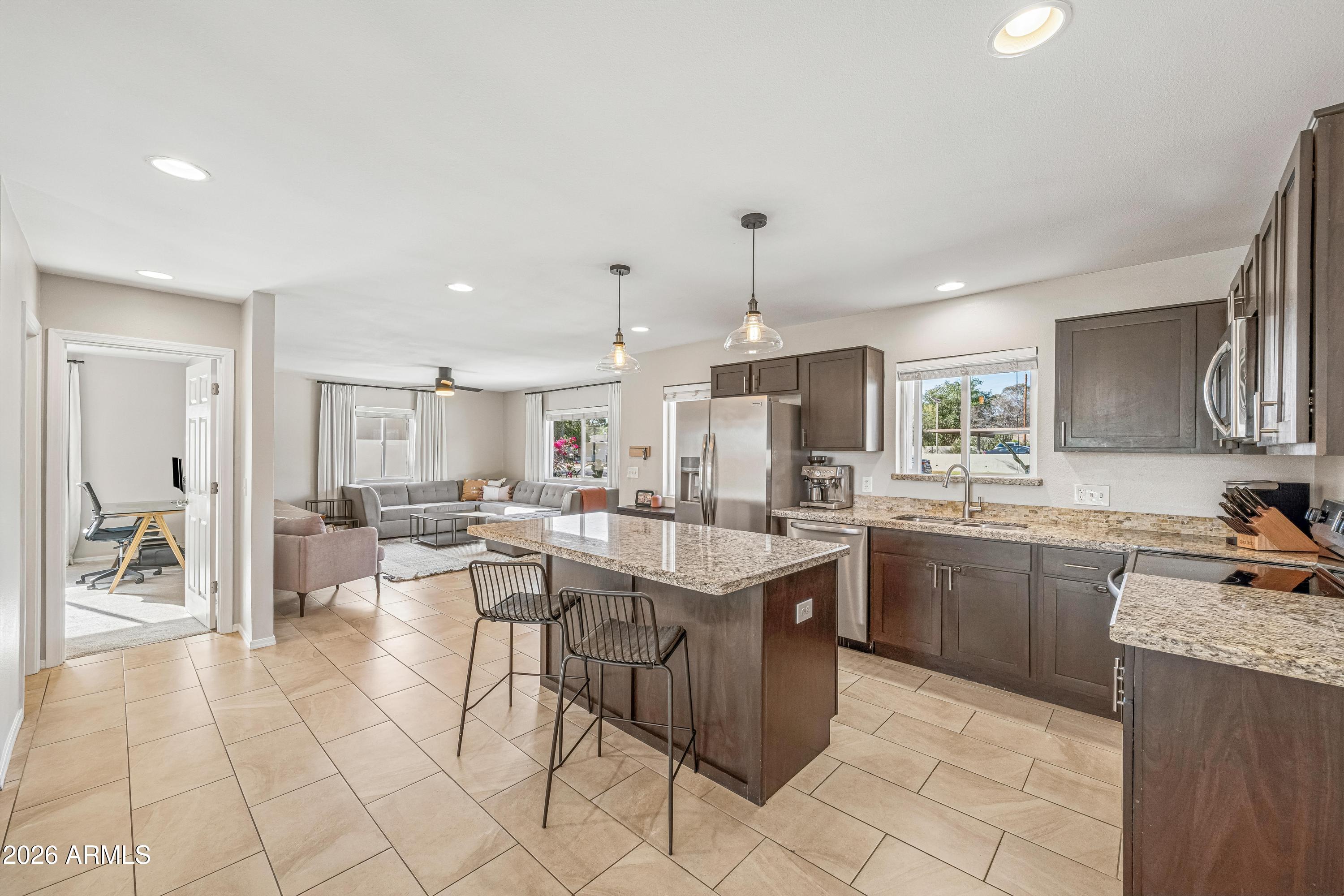 2327 East Weldon Avenue Phoenix, AZ 85016 - Photo 9 of 34 a kitchen with counter top space appliances and cabinets