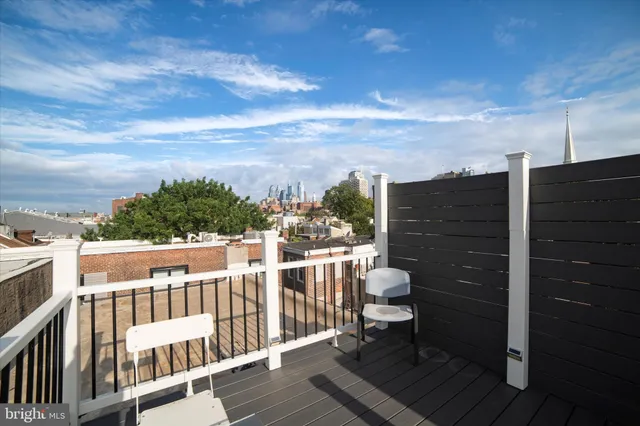 a view of a balcony with yard