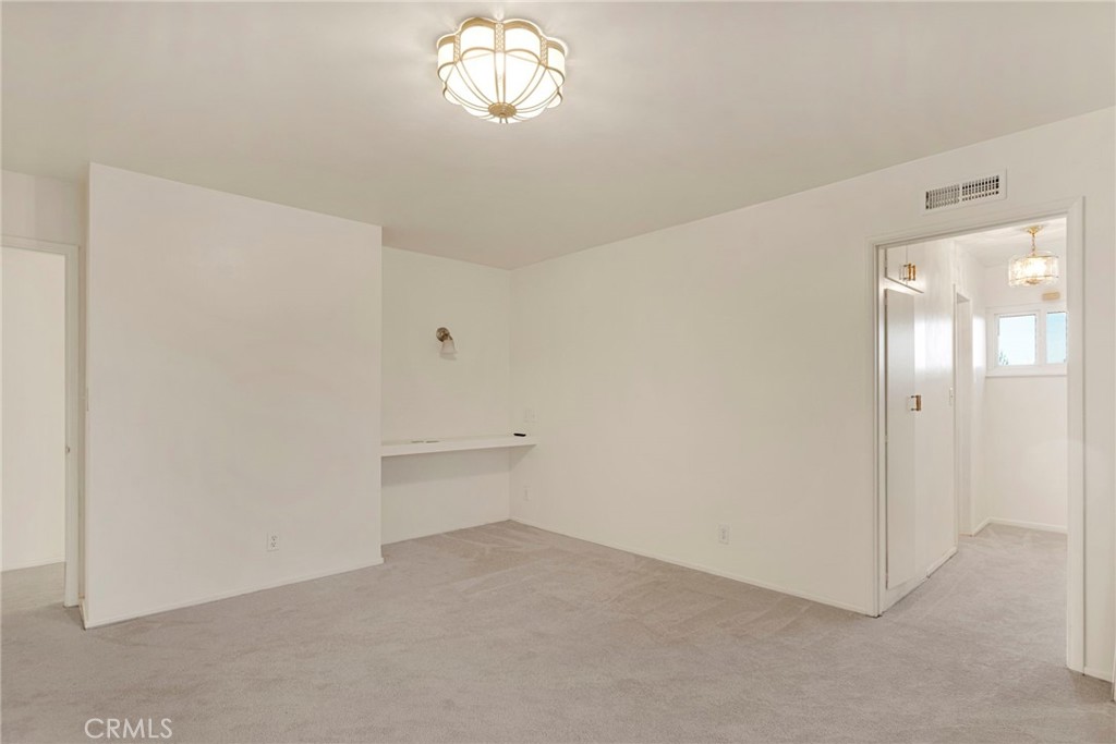 15177 Mendota Road North Apple Valley, CA 92307 - Photo 14 of 50 an empty room with chandelier fan