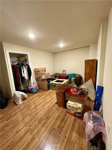 a view of a workspace with furniture and wooden floor