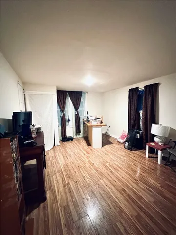 a bed room with a bed and a chair