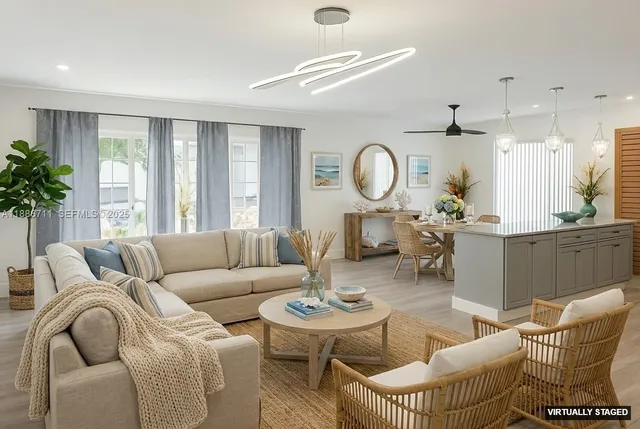 a living room with furniture a large window and a clock
